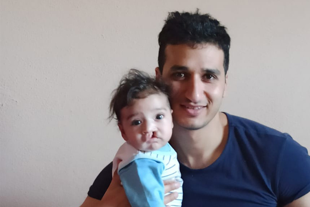 Malek with his father