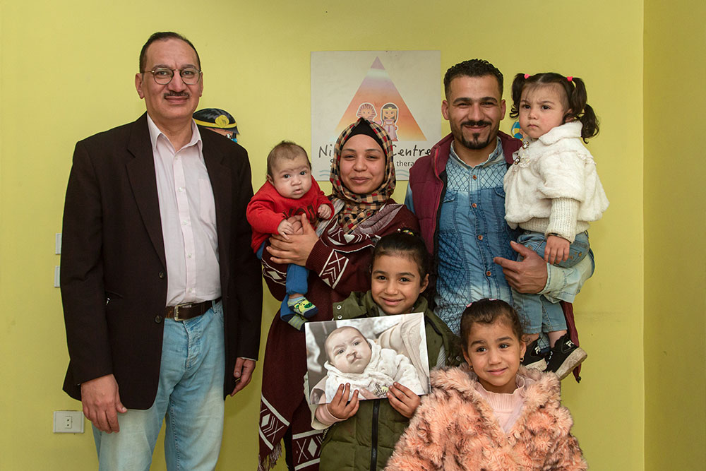 Mustafa with his family after cleft surgery
